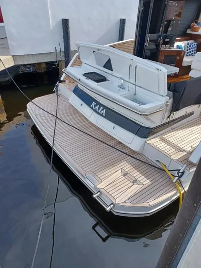 Must Sell, Make An Offer Yacht Photos Pics 2022 Galeon 410 HTC yacht docked, featuring a spacious teak swim platform.