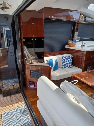 Must Sell, Make An Offer Yacht Photos Pics Luxurious interior of 2022 Galeon 410 HTC yacht with modern seating and decor.