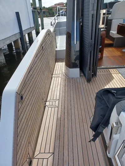 Must Sell, Make An Offer Yacht Photos Pics 2022 Galeon 410 HTC yacht deck with wood finish and seating area.