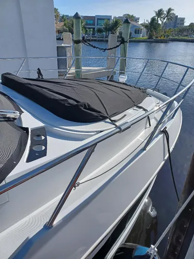 Must Sell, Make An Offer Yacht Photos Pics 2022 Galeon 410 HTC yacht docked by waterfront with covered deck.