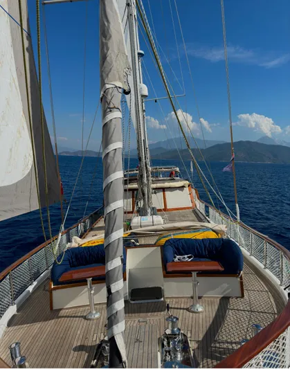 Hama Yacht Photos Pics Sailing on a 1994 Custom ABATS Gulet Ketch with scenic ocean and mountain views.