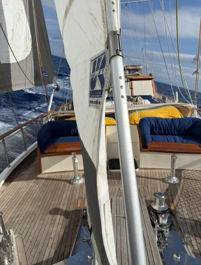 Hama Yacht Photos Pics Sailing on a 1994 Custom ABATS Gulet Ketch with wooden deck and blue seating.