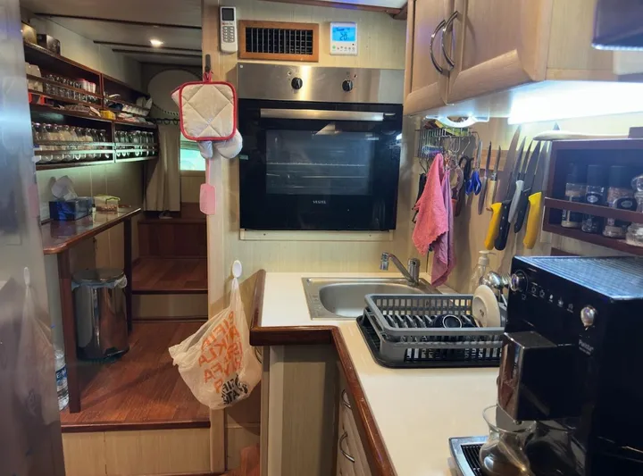 Hama Yacht Photos Pics Cozy kitchen interior of 1994 Custom ABATS Gulet Ketch with modern appliances and organized storage.