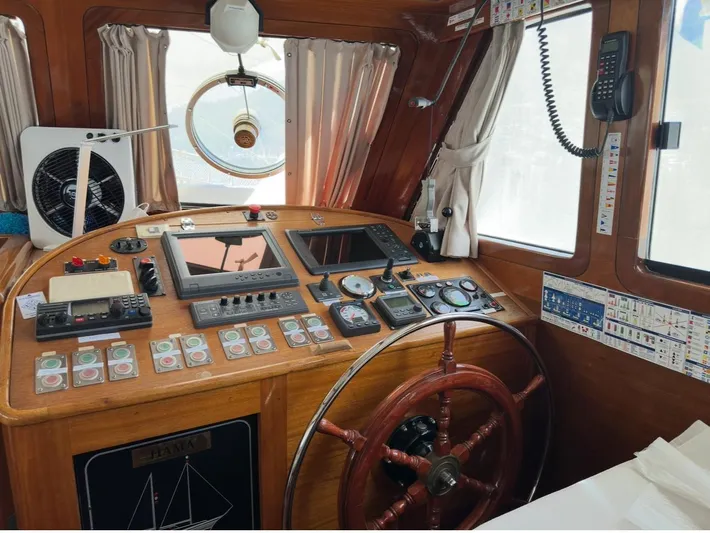 Hama Yacht Photos Pics Cockpit of 1994 Custom ABATS Gulet Ketch with navigation instruments and wooden steering wheel.
