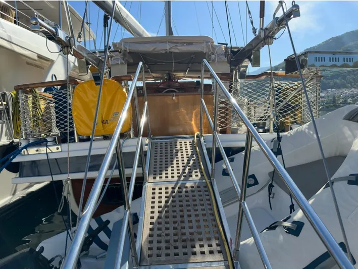Hama Yacht Photos Pics Custom 1994 ABATS Gulet Ketch with boarding ramp and safety equipment, docked in a marina.