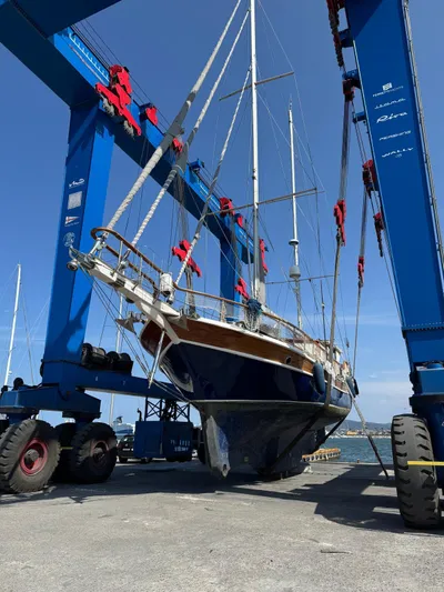 Hama Yacht Photos Pics Custom 1994 ABATS GULET KETCH sailboat in dry dock, supported by blue hoist.