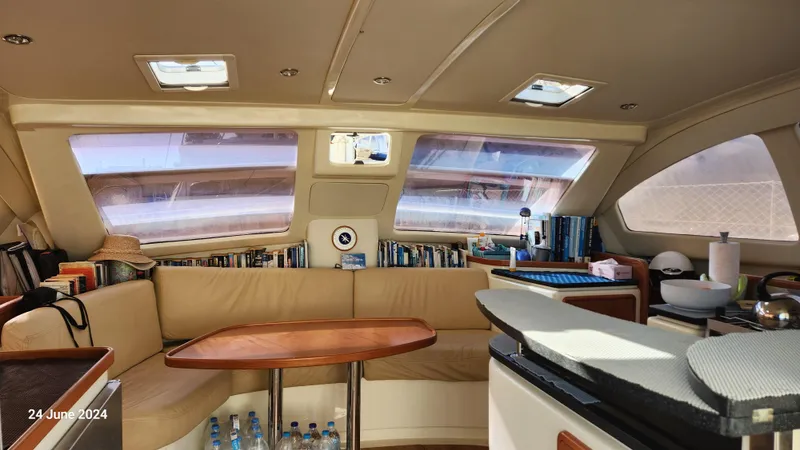  Yacht Photos Pics Interior of a 2007 Leopard 40 catamaran with cozy seating and panoramic windows.