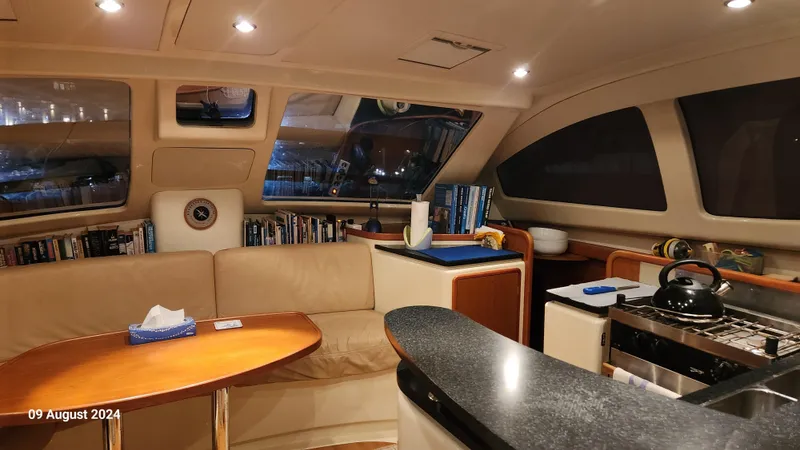  Yacht Photos Pics Luxurious interior of a 2007 Leopard 40 yacht with cozy seating and modern kitchen amenities.