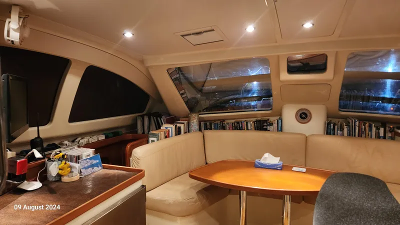 Yacht Photos Pics Interior of a 2007 Leopard 40 catamaran with cozy seating and bookshelves.