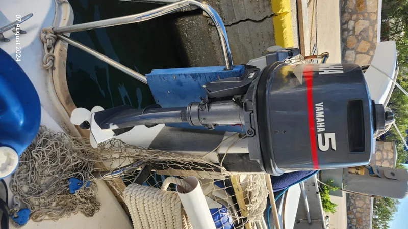  Yacht Photos Pics Yamaha 5 outboard motor on a 2007 Leopard 40 boat, docked with fishing net.