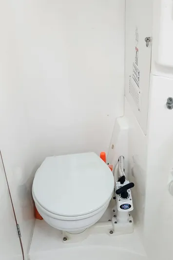  Yacht Photos Pics Compact marine toilet in a 2007 Leopard 40 yacht bathroom.