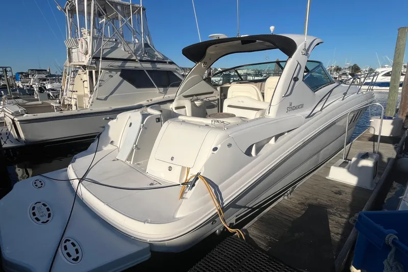 Yacht Photos Pics 2007 Sea Ray 38 Sundancer yacht docked at marina, showcasing sleek design and spacious deck.