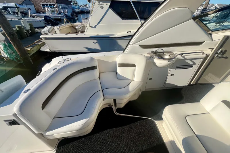  Yacht Photos Pics 2007 Sea Ray 38 Sundancer interior with white seating and kitchenette area.