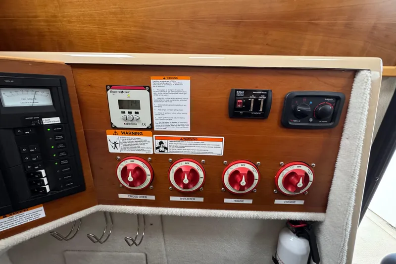  Yacht Photos Pics 2014 Cutwater 28 control panel with switches, meters, and warning labels.