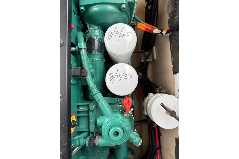  Yacht Photos Pics Engine compartment of a 2014 Cutwater 28 boat with visible filters and hoses.