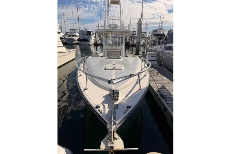  Yacht Photos Pics 1997 Marlin Yachts 350SF docked at marina under blue sky.