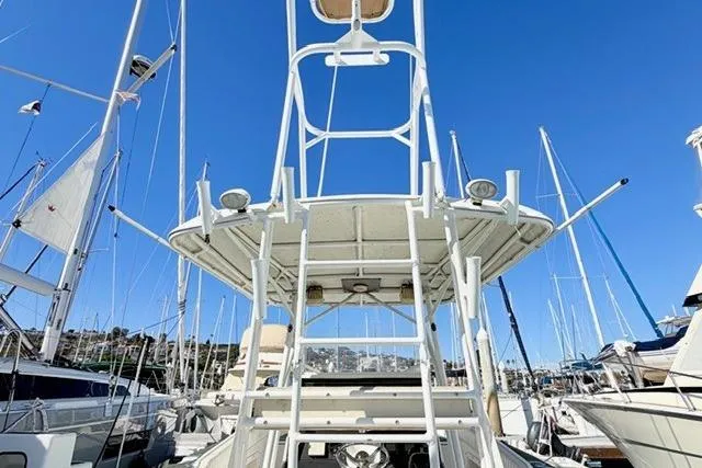  Yacht Photos Pics 1997 Marlin Yachts 350SF boat tower with clear blue sky background.