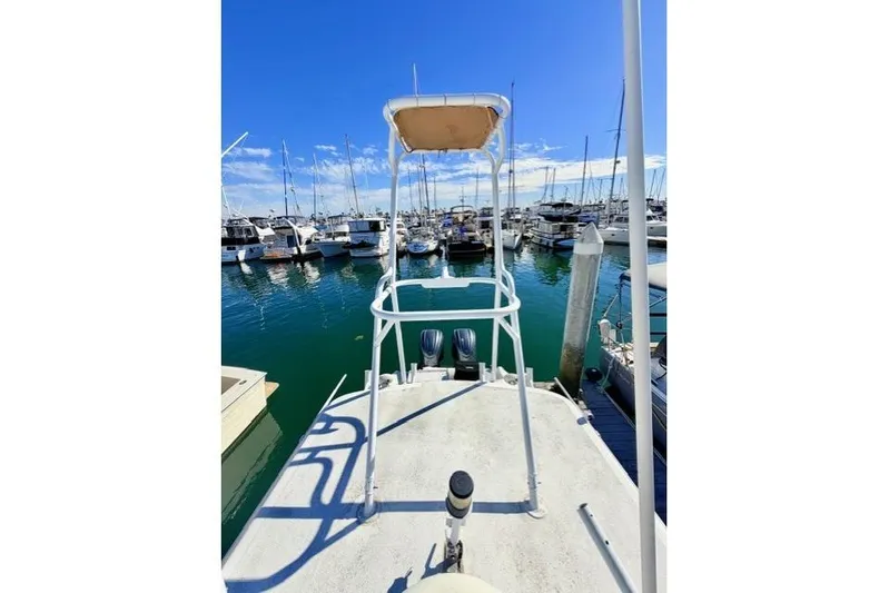  Yacht Photos Pics 1997 Marlin Yachts 350SF at marina, clear sky, calm water, docked boats.