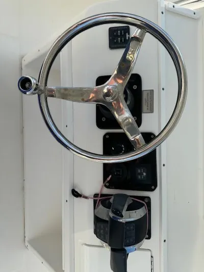  Yacht Photos Pics Steering wheel and controls of a 2006 Regulator 32 FS boat.