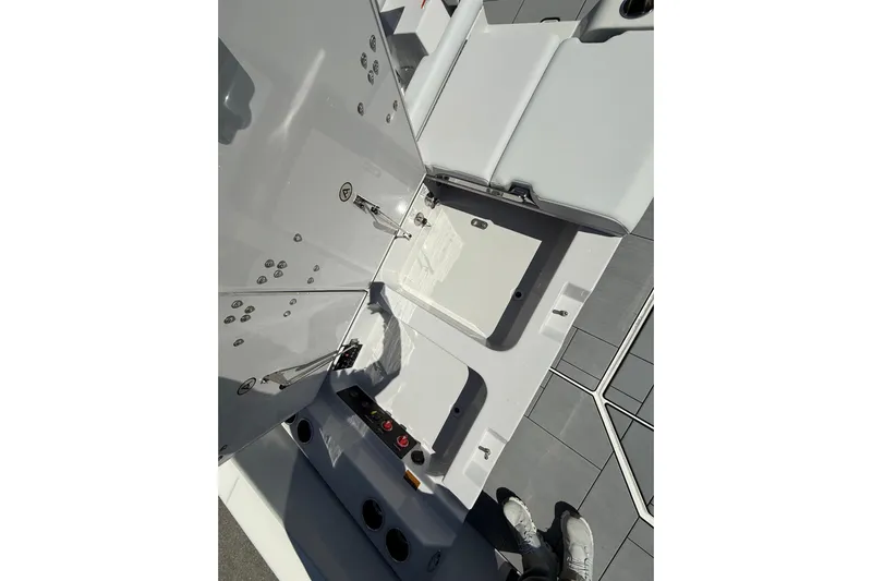 Andiamo Yacht Photos Pics 2023 Aviara AV32 I/O boat interior showing storage compartments and seating area.
