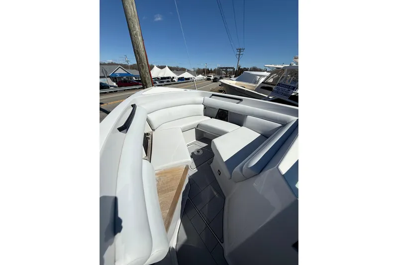 Andiamo Yacht Photos Pics 2023 Aviara AV32 I/O boat interior with white seating and wood accents.