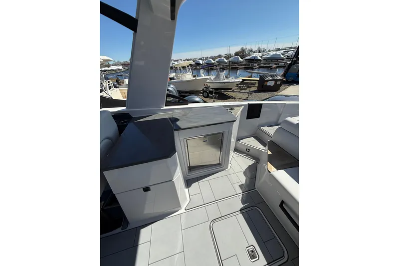 Andiamo Yacht Photos Pics 2023 Aviara AV32 I/O boat interior with sleek design and marina view.