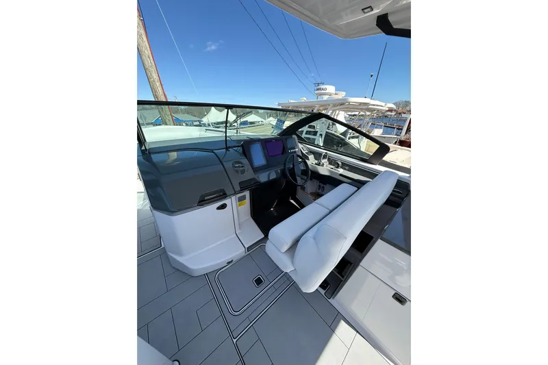 Andiamo Yacht Photos Pics 2023 Aviara AV32 I/O boat interior with modern helm and seating.