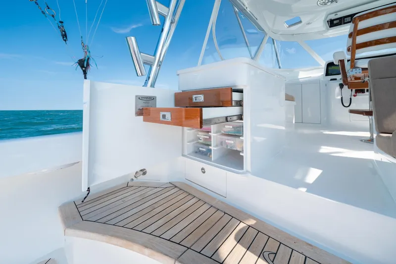 Hawk's Nest Yacht Photos Pics 2012 Shearline 34' Express boat interior with open storage drawers, ocean view.