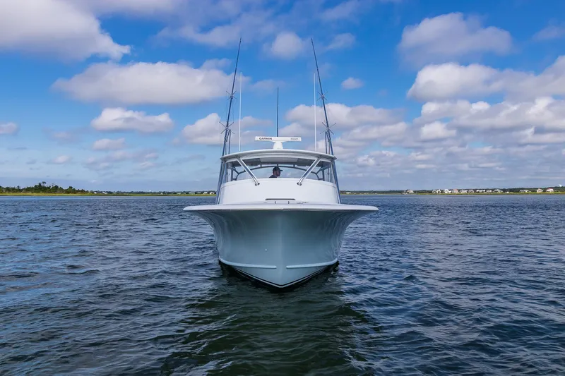 Hawk's Nest Yacht Photos Pics 2012 Shearline 34' Express boat on open water under blue sky.