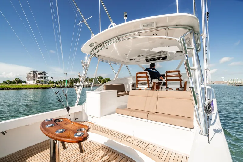 Hawk's Nest Yacht Photos Pics 2012 Shearline 34' Express yacht with spacious deck and seating, cruising on a sunny day.