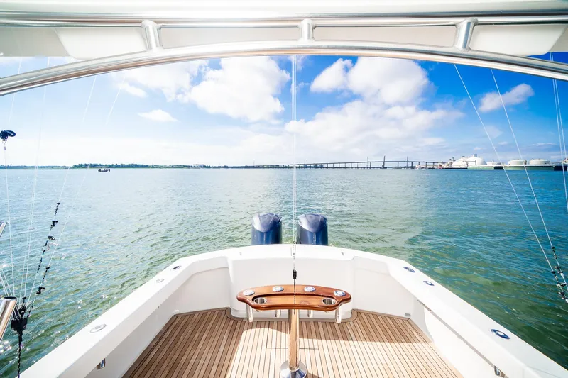 Hawk's Nest Yacht Photos Pics 2012 Shearline 34' Express boat with scenic ocean view and clear blue sky.