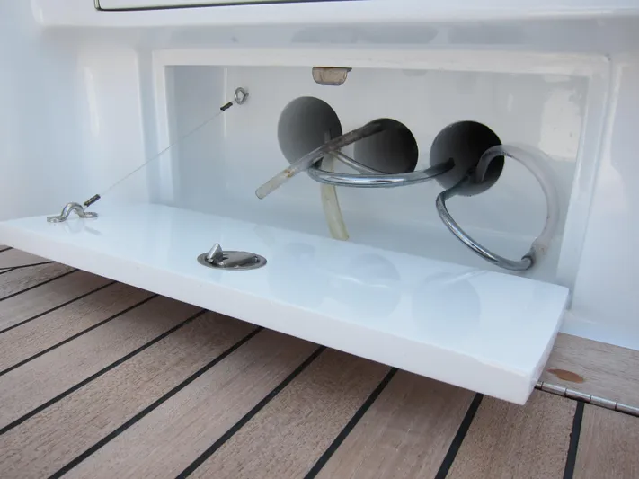 Hawk's Nest Yacht Photos Pics Storage compartment on 2012 Shearline 34' Express boat with cables and hoses.