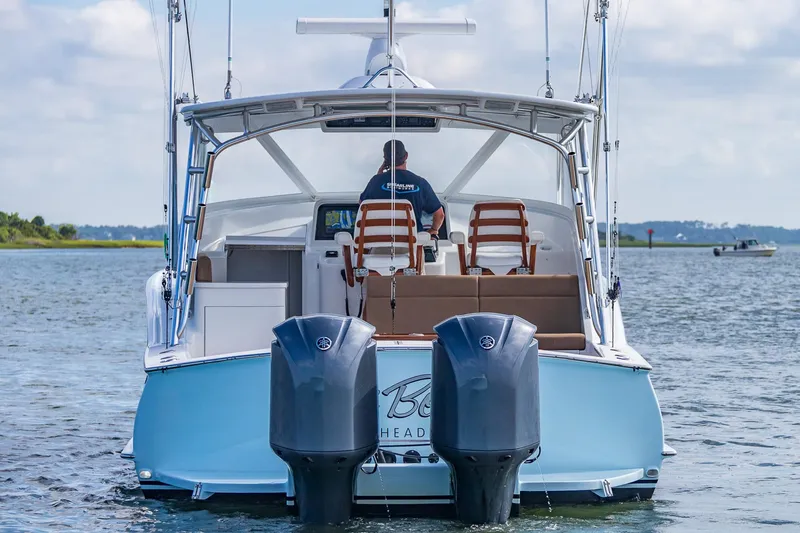 Hawk's Nest Yacht Photos Pics 2012 Shearline 34' Express boat on water, rear view with dual engines.