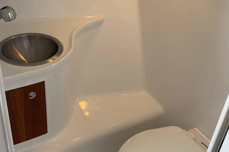 Hawk's Nest Yacht Photos Pics 2012 Shearline 34' Express boat bathroom with sink and toilet.