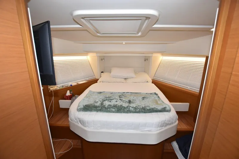  Yacht Photos Pics Luxurious bedroom interior of 2023 Beneteau Swift Trawler 41 Fly yacht.