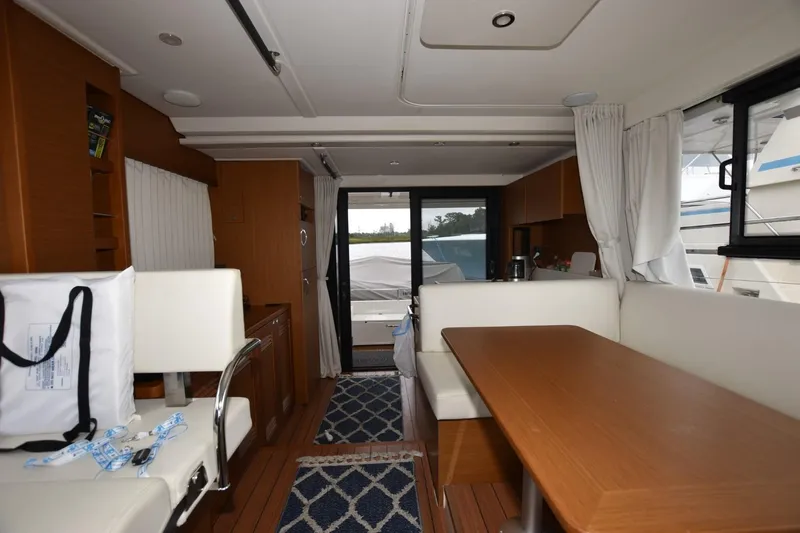  Yacht Photos Pics Interior of 2023 Beneteau Swift Trawler 41 Fly, featuring modern seating and dining area.