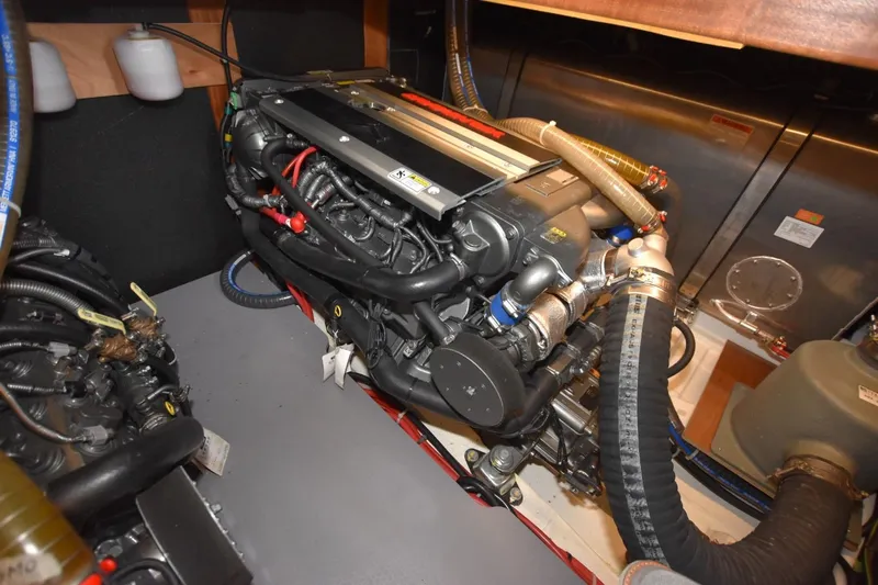  Yacht Photos Pics Engine room of 2023 Beneteau Swift Trawler 41 Fly, showcasing detailed mechanical components.