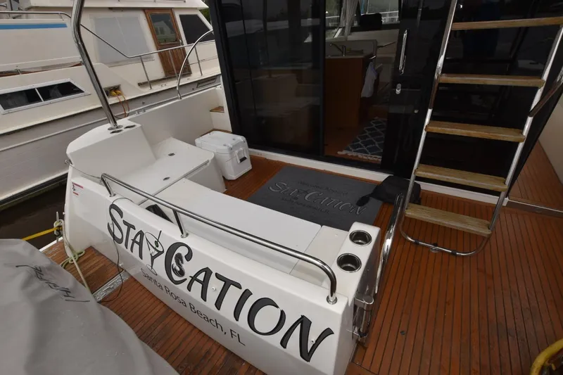  Yacht Photos Pics 2023 Beneteau Swift Trawler 41 Fly deck with "Staycation" branding, Santa Rosa Beach, FL.