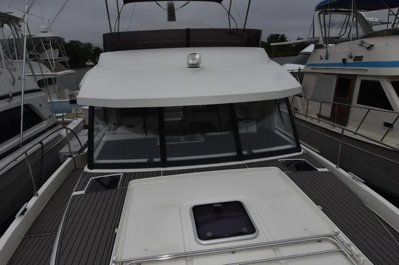  Yacht Photos Pics 2023 Beneteau Swift Trawler 41 Fly, docked, showcasing sleek design and spacious deck.