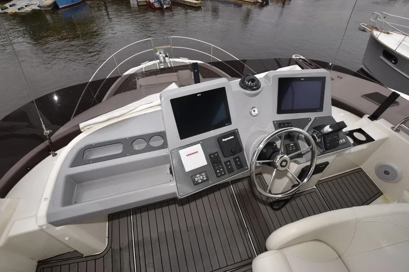  Yacht Photos Pics 2023 Beneteau Swift Trawler 41 Fly helm with dual screens and steering wheel.