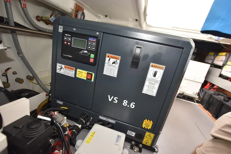  Yacht Photos Pics Engine room of 2023 Beneteau Swift Trawler 41 Fly with generator and control panel.