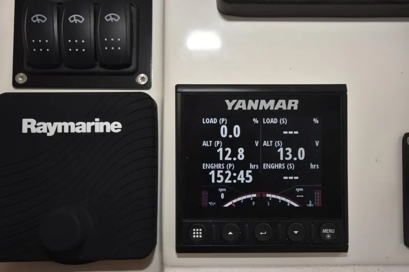  Yacht Photos Pics Control panel of 2023 Beneteau Swift Trawler 41 Fly with Yanmar and Raymarine displays.
