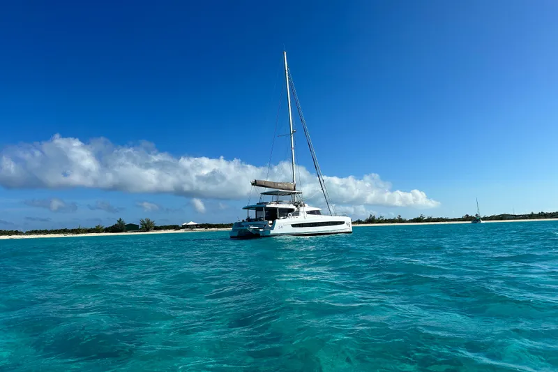High 5 Yacht Photos Pics 2024 Bali 5.4 catamaran sailing in clear turquoise waters under a bright blue sky.
