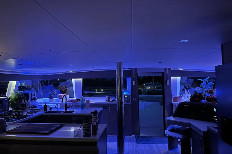 High 5 Yacht Photos Pics Luxurious interior of 2024 Bali 5.4 yacht with modern kitchen and ambient lighting.