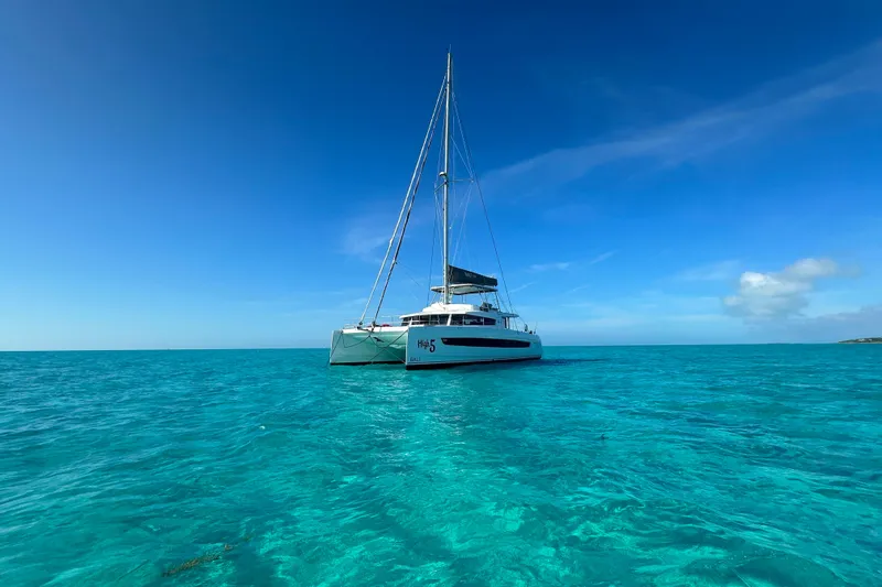 High 5 Yacht Photos Pics 2024 Bali 5.4 catamaran sailing on clear turquoise waters under a bright blue sky.