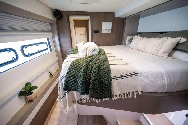High 5 Yacht Photos Pics Luxurious 2024 Bali 5.4 yacht bedroom with elegant decor and natural light.