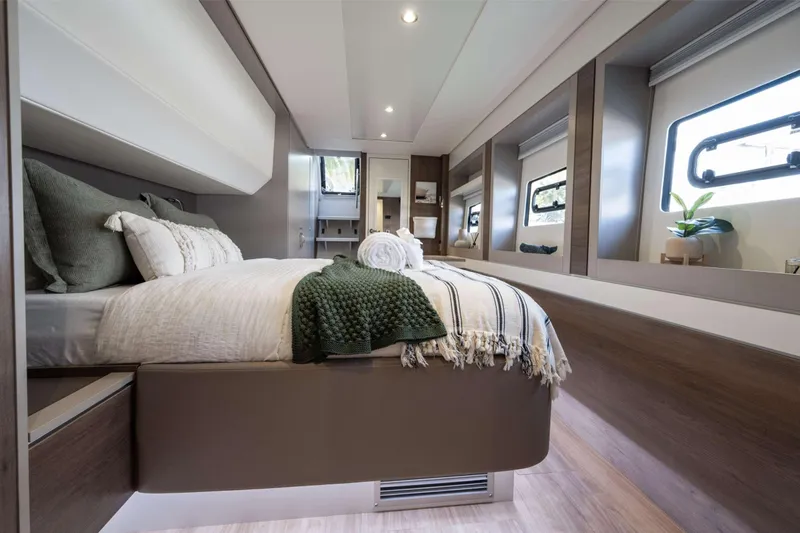 High 5 Yacht Photos Pics Luxurious 2024 Bali 5.4 yacht bedroom with modern decor and large windows.