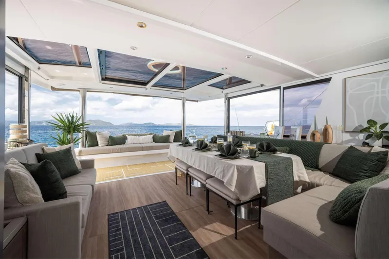 High 5 Yacht Photos Pics Luxurious interior of 2024 Bali 5.4 yacht with elegant dining setup and ocean view.