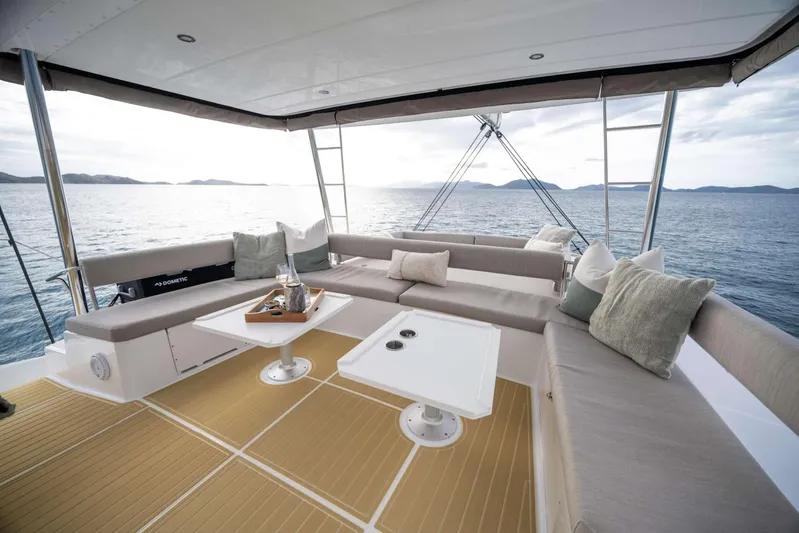 High 5 Yacht Photos Pics Luxurious 2024 Bali 5.4 yacht deck with comfortable seating and ocean view.