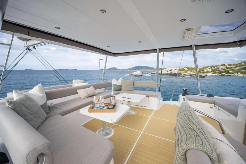 High 5 Yacht Photos Pics Luxurious 2024 Bali 5.4 yacht interior with ocean view and elegant seating area.